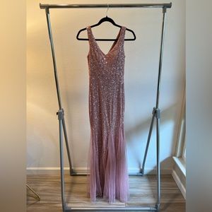 Rose colored sequin gown with Thule. Never worn. Tags on.